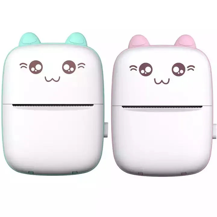 Two small electronic devices with cute face designs on a white background