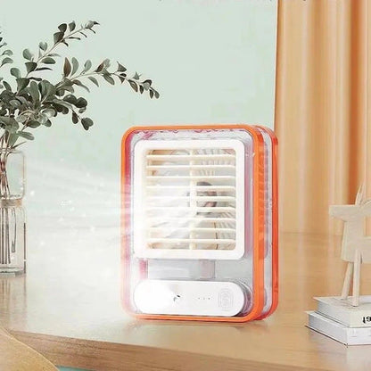 Small portable air conditioner on a desk with a light blue wall and plant in the background