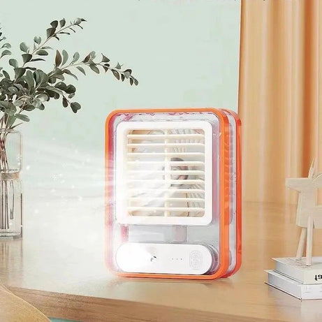 Small portable air conditioner on a desk with a light blue wall and plant in the background