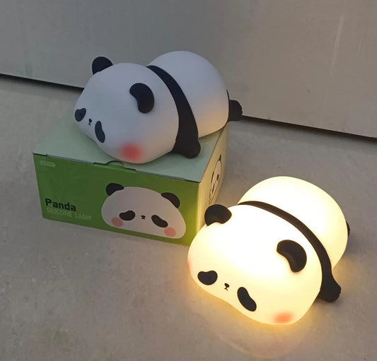 Panda-shaped night light with packaging on a white surface